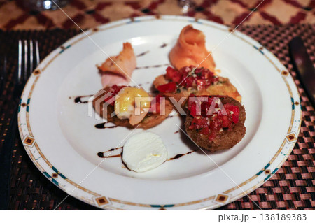 Exquisite Italian Cuisine Dishes Served in an A La Carte Restaurant at a Luxurious Resort, Showcasing Culinary Artistry and Flavorful Ingredients 138189383