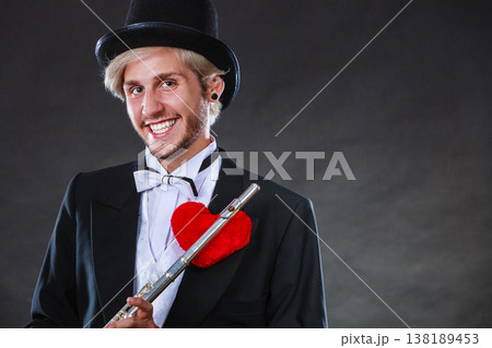 Male flutist with flute and heart. Love melody 138189453