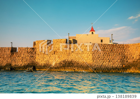 View of the southern sea wall of the Acre city, and the catholic Church of St. John (Saint John the Baptist Church), Acre, Israel 138189839