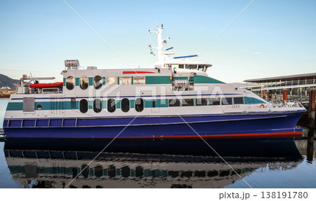 A modern passenger ferry with blue and white hull A modern passenger ferry with blue and white hull 138191780