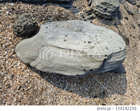 Close-Up of Natural Stone on Pebbled Beach Shoreline Close-Up of Natural Stone on Pebbled Beach Shoreline 138192258