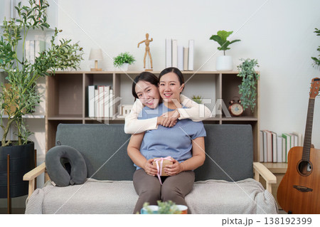 Mother and daughter embracing with love and gratitude 138192399