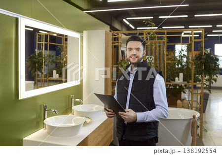 Portrait Of Happy Salesman In Plumbing Shop Portrait Of Happy Salesman In Plumbing Shop 138192554