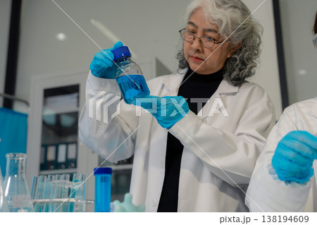 Scientist works with a pipette and a test tube. Scientific laboratory of biotechnology, development of medicine and research in chemistry, biochemistry and experiments. Scientist works with a pipette and a test tube. Scientific laboratory of biotechnology, development of medicine and research in chemistry, biochemistry and experiments. 138194609
