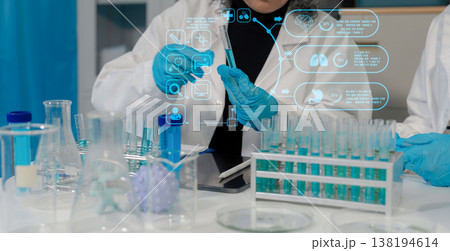 Scientist works with a pipette and a test tube. Scientific laboratory of biotechnology, development of medicine and research in chemistry, biochemistry and experiments. 138194614
