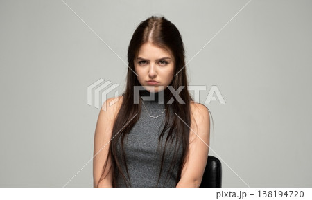 Young woman showing frustration, feeling disappointment, looking upset and annoyed with a sad frown Young woman showing frustration, feeling disappointment, looking upset and annoyed with a sad frown 138194720