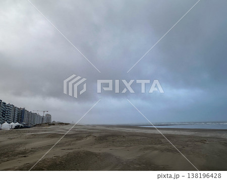 Nieuwpoort, West-Vlaanderen, Belgium, Ocotber 25th, 2025, Empty sandy shoreline beneath menacing 138196428
