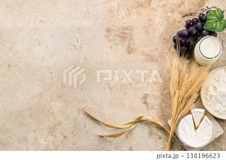 Shavuot holiday symbols on travertine background Shavuot holiday symbols on travertine background 138196623