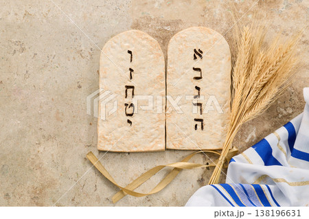 Ten commandments tablets with wheat and tallit celebrating shavuot 138196631