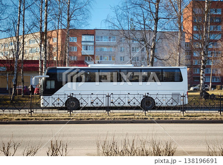 Bus parked on the street near residential buildings on a sunny day Bus parked on the street near residential buildings on a sunny day 138196691