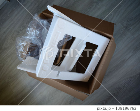 Cardboard box contains packing material and item set for assembly in living room Cardboard box contains packing material and item set for assembly in living room 138196762