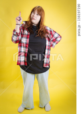 Young woman thinking, pointing up, having new idea Young woman thinking, pointing up, having new idea 138197190