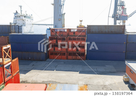 Cargo ship loading containers at commercial port terminal 138197364