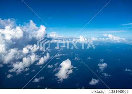 Aerial view of fluffy clouds over the Pacific Ocean in Polynesia Aerial view of fluffy clouds over the Pacific Ocean in Polynesia 138198065