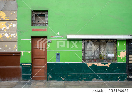 Green wall with windows and door in Lima, Peru 138198081