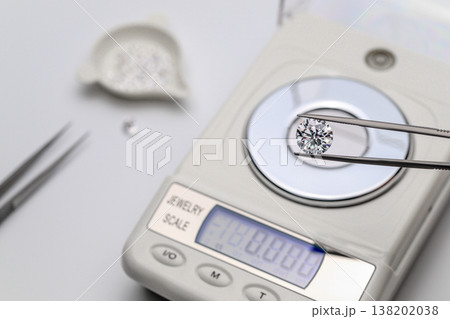 Close-up of diamond on scale, ready for valuation 138202038