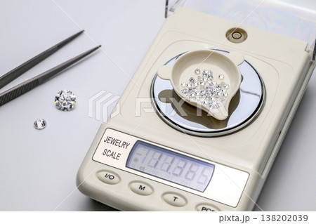 Shiny gems weigh precisely on a scale Shiny gems weigh precisely on a scale 138202039