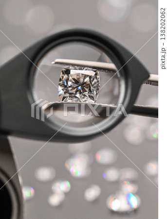 Close-up of diamond under magnifier Close-up of diamond under magnifier 138202062