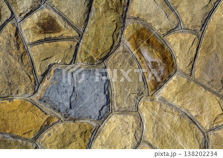 Different sizes of sand stones. Stone wall pattern background Different sizes of sand stones. Stone wall pattern background 138202234