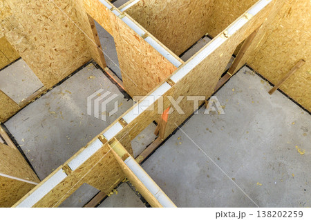 Construction of new and modern modular house. Walls made from composite wooden sip panels with styrofoam insulation inside. Building new frame of energy efficient home concept. 138202259