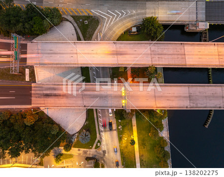 Complex freeway interchange in Tampa with elevated roads, bridges and city lights defining modern American metropolis. 138202275