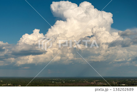 Blue sky with flying white clouds over Florida suburbs. Colorful summer skyscape 138202689