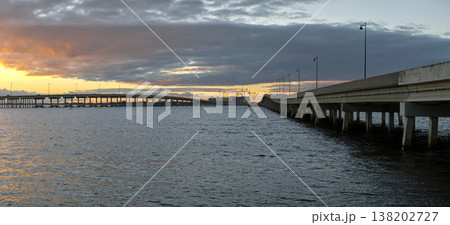 Barron Collier Bridge and Gilchrist Bridge in Florida with moving traffic. Transportation infrastructure in Charlotte County connecting Punta Gorda and Port Charlotte over Peace River 138202727