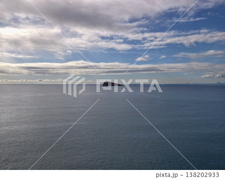 Serene island scene, Calm isle amidst tranquil waters, Peaceful island surrounded by silent ocean waves Serene island scene, Calm isle amidst tranquil waters, Peaceful island surrounded by silent ocean waves 138202933