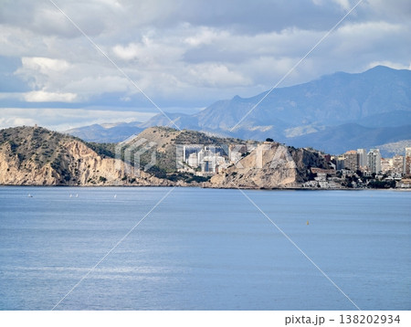 Harbor scenery with cliffs, Charming seaside village featuring promontory and mountain scenery Harbor scenery with cliffs, Charming seaside village featuring promontory and mountain scenery 138202934