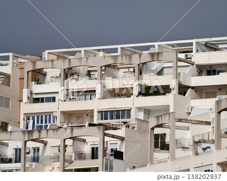 Sundrenched outdoor space with plants, Charming rooftop garden with shadows and vibrant vegetation 138202937