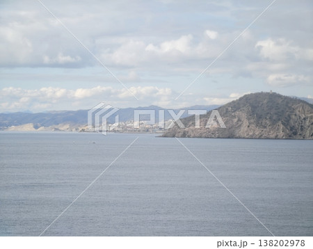 Mountainsheltered bay views, Peacful port setting framed by distant mountains and gentle waters 138202978
