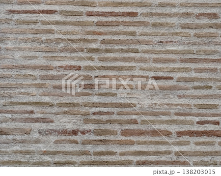 Subtle textured brick wall featuring gentle beige hues and precise horizontal layer alignment Subtle textured brick wall featuring gentle beige hues and precise horizontal layer alignment 138203015
