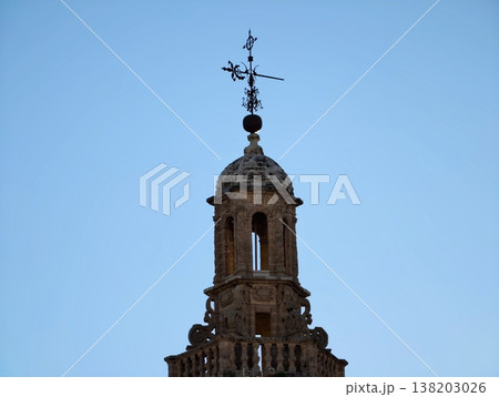 Architectural view of historic bell tower with spire set against clean blue sky background Architectural view of historic bell tower with spire set against clean blue sky background 138203026