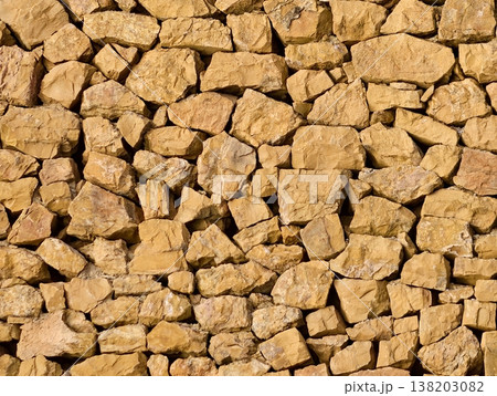 Warm textured stones, Detailed view of aged masonry showcasing craftsmanship and natural hues Warm textured stones, Detailed view of aged masonry showcasing craftsmanship and natural hues 138203082