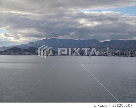 Spacious seaside landscape showcasing faroff metropolis and peaceful water surfaces for artistic backgrounds Spacious seaside landscape showcasing faroff metropolis and peaceful water surfaces for artistic backgrounds 138203107