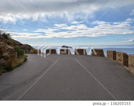 Secluded seaside highway, Remote shoreline route ending at rocky safety barriers with expansive ocean scenery Secluded seaside highway, Remote shoreline route ending at rocky safety barriers with expansive ocean scenery 138203153