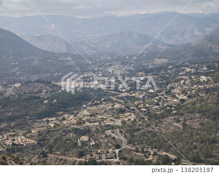 Countryside landscape view, Serene mountain backdrop highlights quaint villages and verdant hillsides Countryside landscape view, Serene mountain backdrop highlights quaint villages and verdant hillsides 138203197