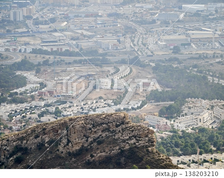 Rugged outcrop offers majestic perspective over expansive metropolitan area and distant port Rugged outcrop offers majestic perspective over expansive metropolitan area and distant port 138203210