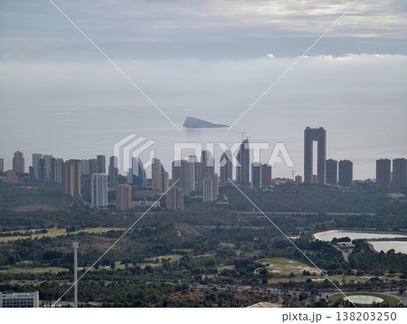 Maritime cityscape with lush hills, Calm ocean view featuring distant islands and urban skyline Maritime cityscape with lush hills, Calm ocean view featuring distant islands and urban skyline 138203250