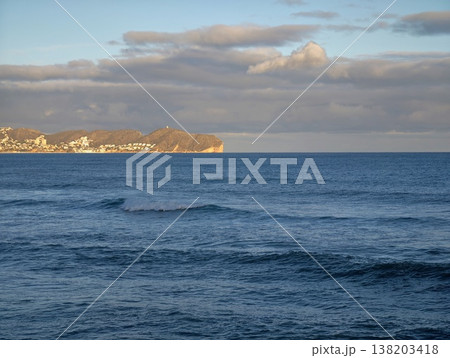 Calm ocean view with colorful sky, Peaceful shoreline under pastel skies during golden hour light Calm ocean view with colorful sky, Peaceful shoreline under pastel skies during golden hour light 138203418