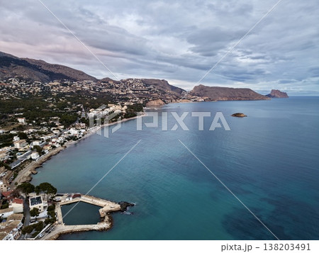 Seashore morning scenery with resorts, Early morning hues over ocean and beachfront accommodations 138203491
