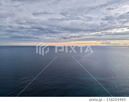 Serene horizon scene, Calm scene where gentle clouds and steady land symbolize enduring strength and hope Serene horizon scene, Calm scene where gentle clouds and steady land symbolize enduring strength and hope 138203493