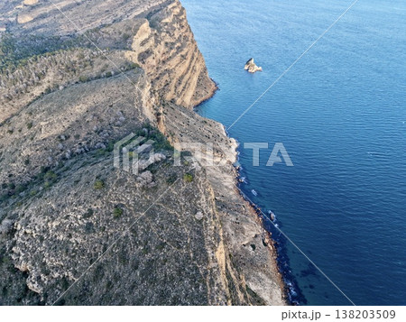 Seaside rocky promontory scene, Drone captures shoreline with limestone formations and tranquil waters 138203509