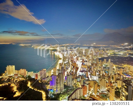 City from above, Overhead view highlighting thriving metropolis set against natural mountainous landscape City from above, Overhead view highlighting thriving metropolis set against natural mountainous landscape 138203531