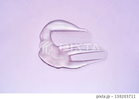 Purple cosmetic gel serum texture spreading on background Purple cosmetic gel serum texture spreading on background 138203711