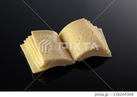 Cheese slices folded like an open book. 138204309