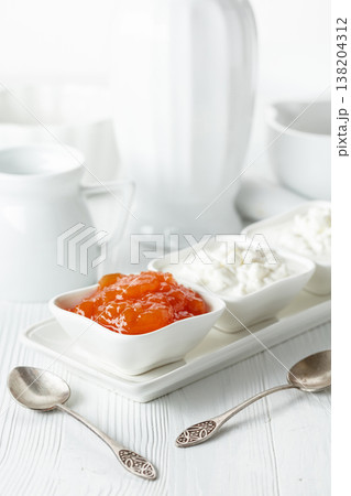 Cottage cheese with quince jam. 138204312