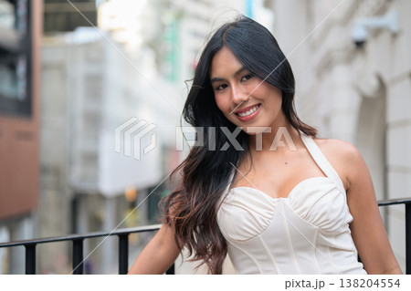 Asian Woman Smiling on Balcony in Central Hong Kong Asian Woman Smiling on Balcony in Central Hong Kong 138204554