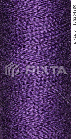 macro texture of a skein of purple sewing thread 138204880