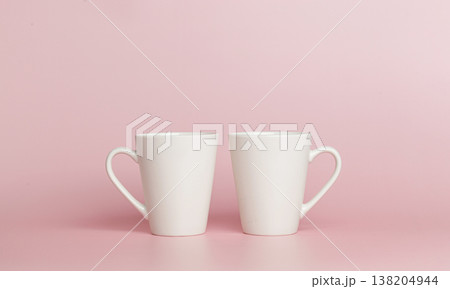 white cups for tea or coffee on a pink background white cups for tea or coffee on a pink background 138204944